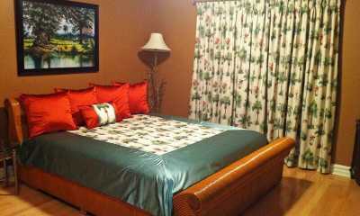 Tropical print on draperies with matching bedding and pillows