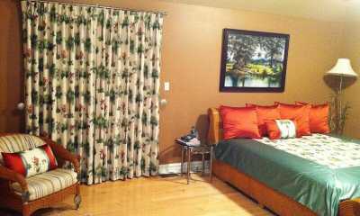 Tropical print on curtains with matching bedding and pillows