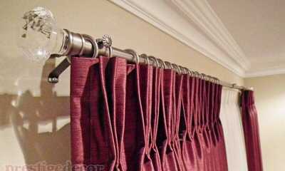 Modern crystal finials and iron hardware with elegant pinch pleat curtains.