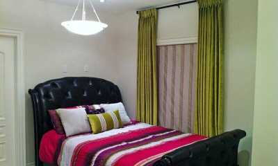 Green velvet draperies and roman blinds with matching custom cushion