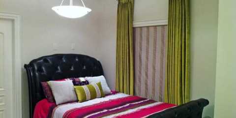 Green velvet draperies and roman blinds with matching custom cushion