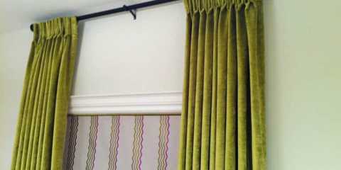 Green velvet draperies and roman blinds