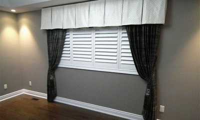 Master bedroom curtains with a valance in a Brampton home.