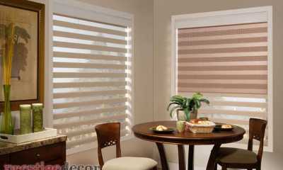 The window on the left has the blackout shade lowered to show the various control option you have when you choose our tri-shade Mandalay horizontal blinds.