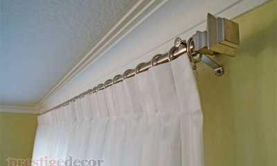 Custom sheers on a decorative rod with finials