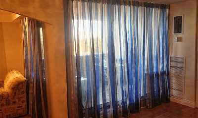 Blue stripped sheer curtains in a Etobicoke Condo on Lakeshore Rd.
