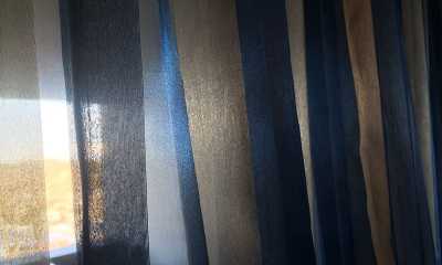 Closeup of blue sheer drapes in a condo on Lakeshore Rd in Etobicoke