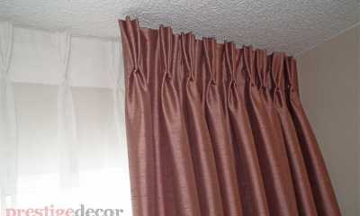 Beige fabric grommet style curtains