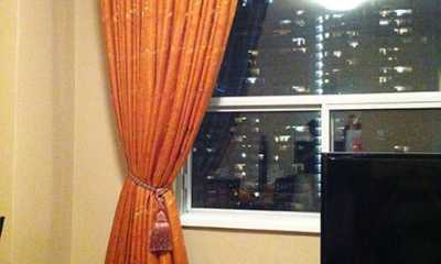 Orange silk curtain fabric in a Toronto condominium