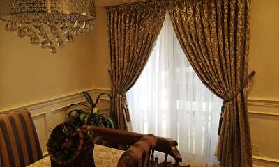 Stuning drapery panels with tiebacks and privacy sheers