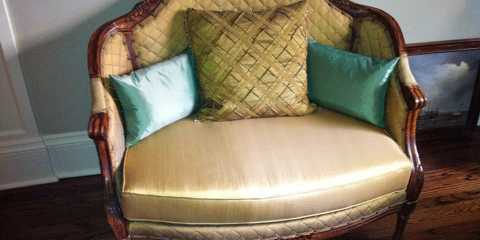 This beautiful fabric gave a royal look to this in silk upholstered chair and half. Pillows add comfort and provide an even cosier look.