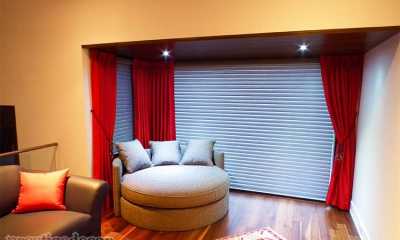 Red Curtains with motorized shades in Etobicoke.