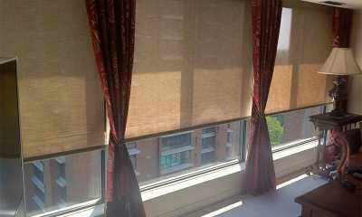A perfect combination of curtains and roller blinds provide privacy, light control and style for this condo in Etobicoke.