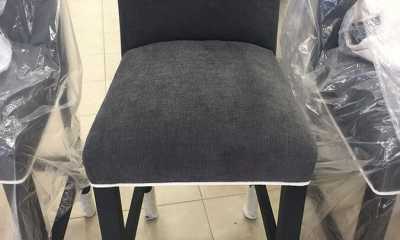 After Photo of chair upholstery in black fabric with white contrast piping
