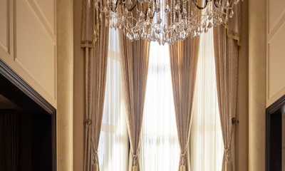 High ceiling custom curtains with matching furniture reupholstery