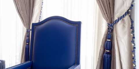 Custom curtains and tiebacks with matching blue upholstery