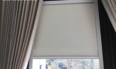 Motorized blackout roller blinds with side channels to block side light from coming in.