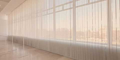 Ballet studio with white sheer curtain fabric on the windows