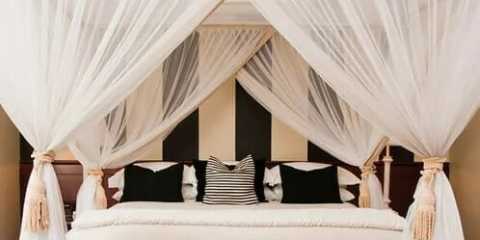 Fabric headboard with a tufted design made of Sheer curtain fabric