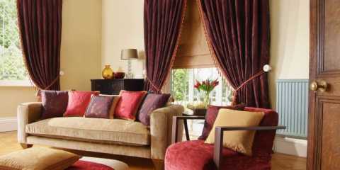 Burgundy velvet drapery fabric adding a touch of luxury to a modern living room