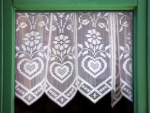 Lace curtain with a hearts, symbol of love