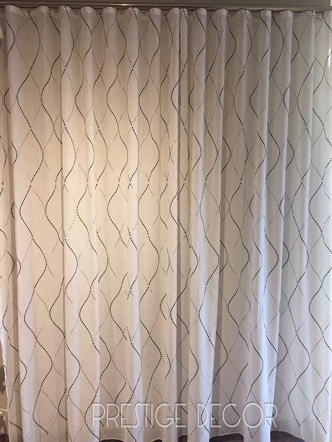 Sun-out ripple fold drapes, ceiling mounted on a KS curtain track