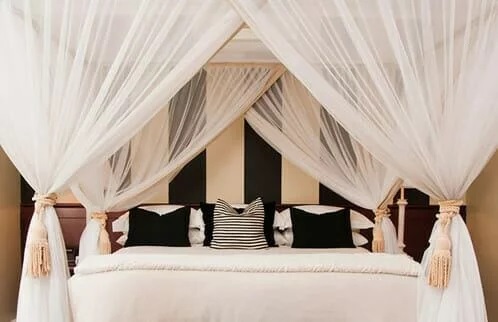 Fabric headboard with a tufted design made of Sheer curtain fabric